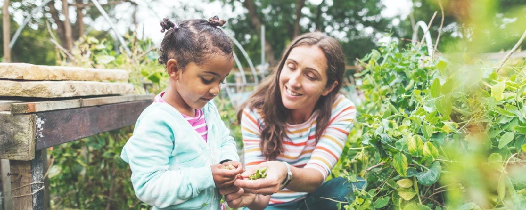 Woman and daughter in garden